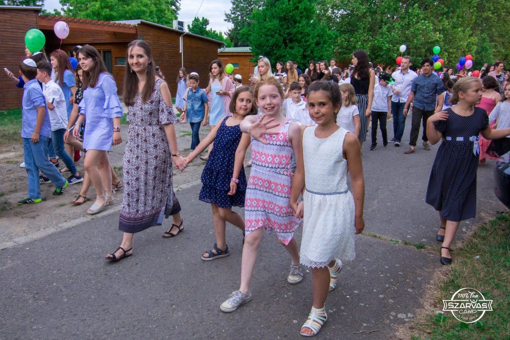 Hanga, as a madricha, walking with some campers.