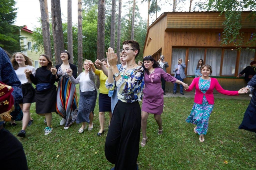 Rachel Simmons claps and dances with a group of Jewish teens in Tomsk, Russia.