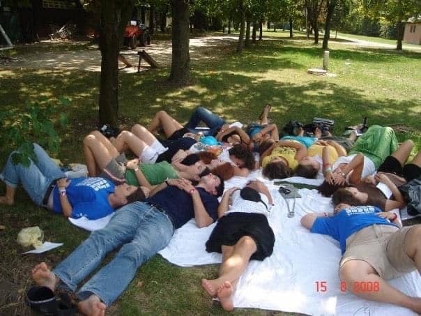 Blanka Nicevic and other campers lie in the sun at Camp Szarvas. Every summer, Blanka travels from her home city of Sarajevo to camp.
