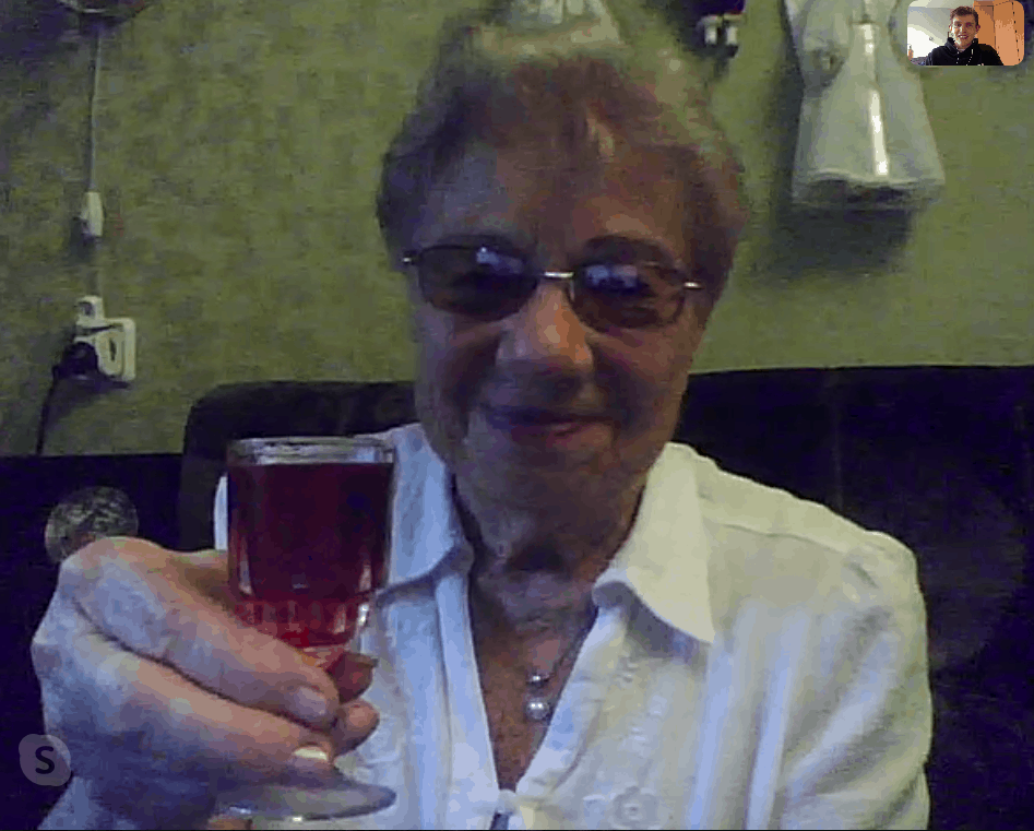 Andrew shares a toast with Emilia Nissenbaum, an 89-year-old JDC client in Odessa.