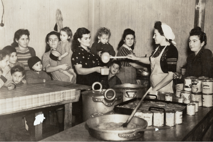 Jewish refugees getting food at a JDC displaced persons camp after World World II.