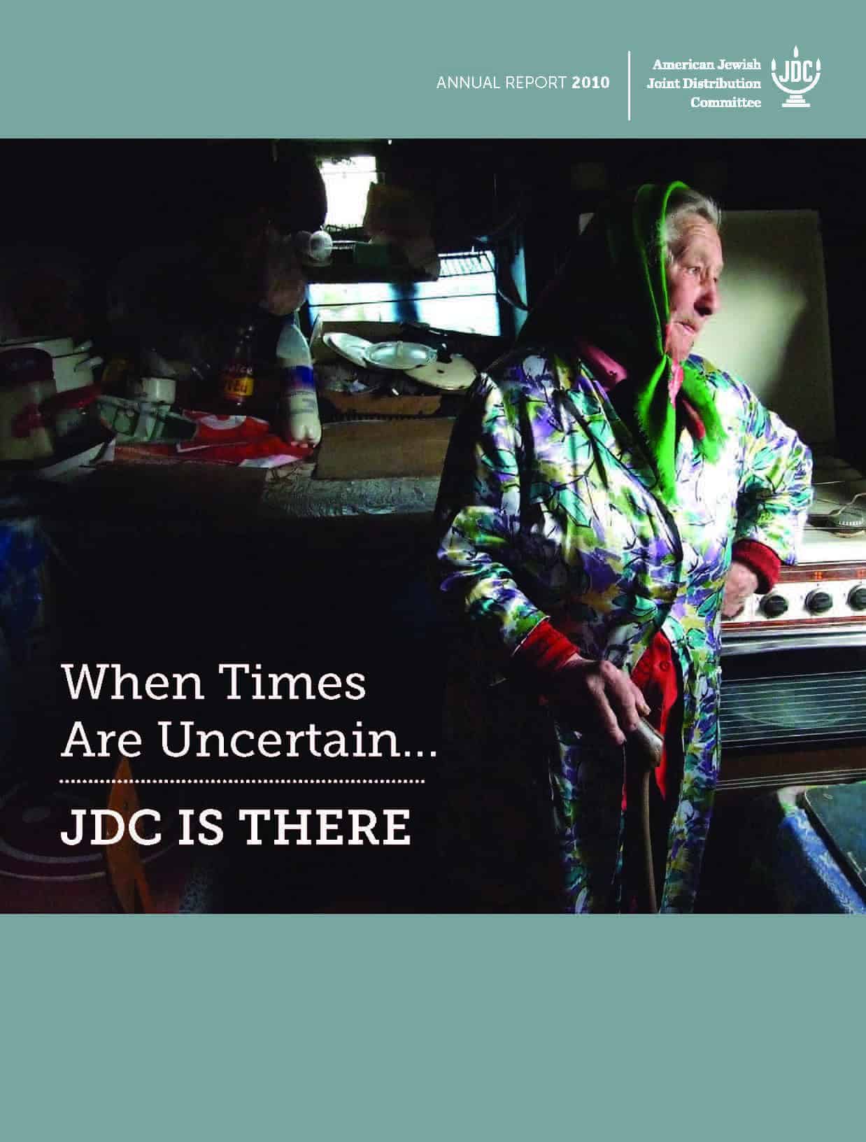 JDC's Annual Report 2011 showing an elderly JDC client in the former Soviet Union standing in her kitchen.