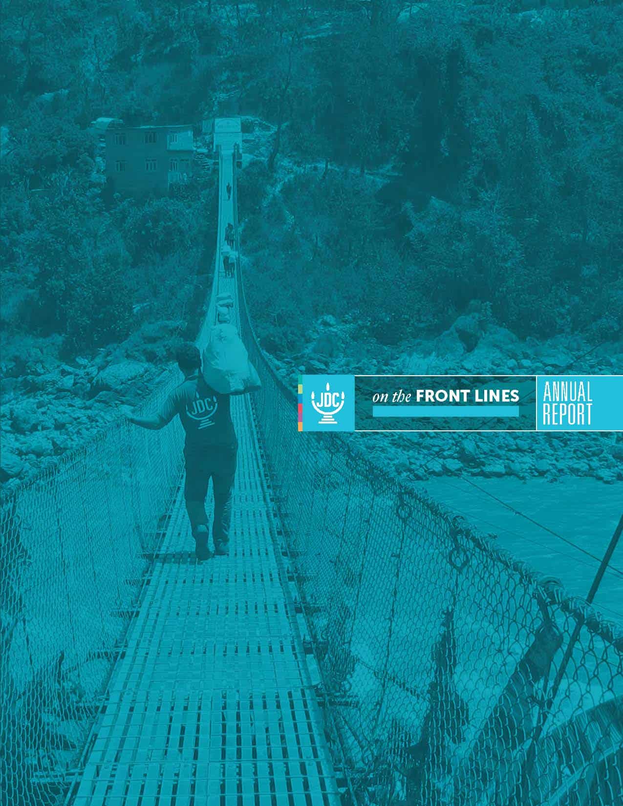 JDC's Annual Report 2016 in which a JDC humanitarian aid worker carries aid across a rope-bridge.