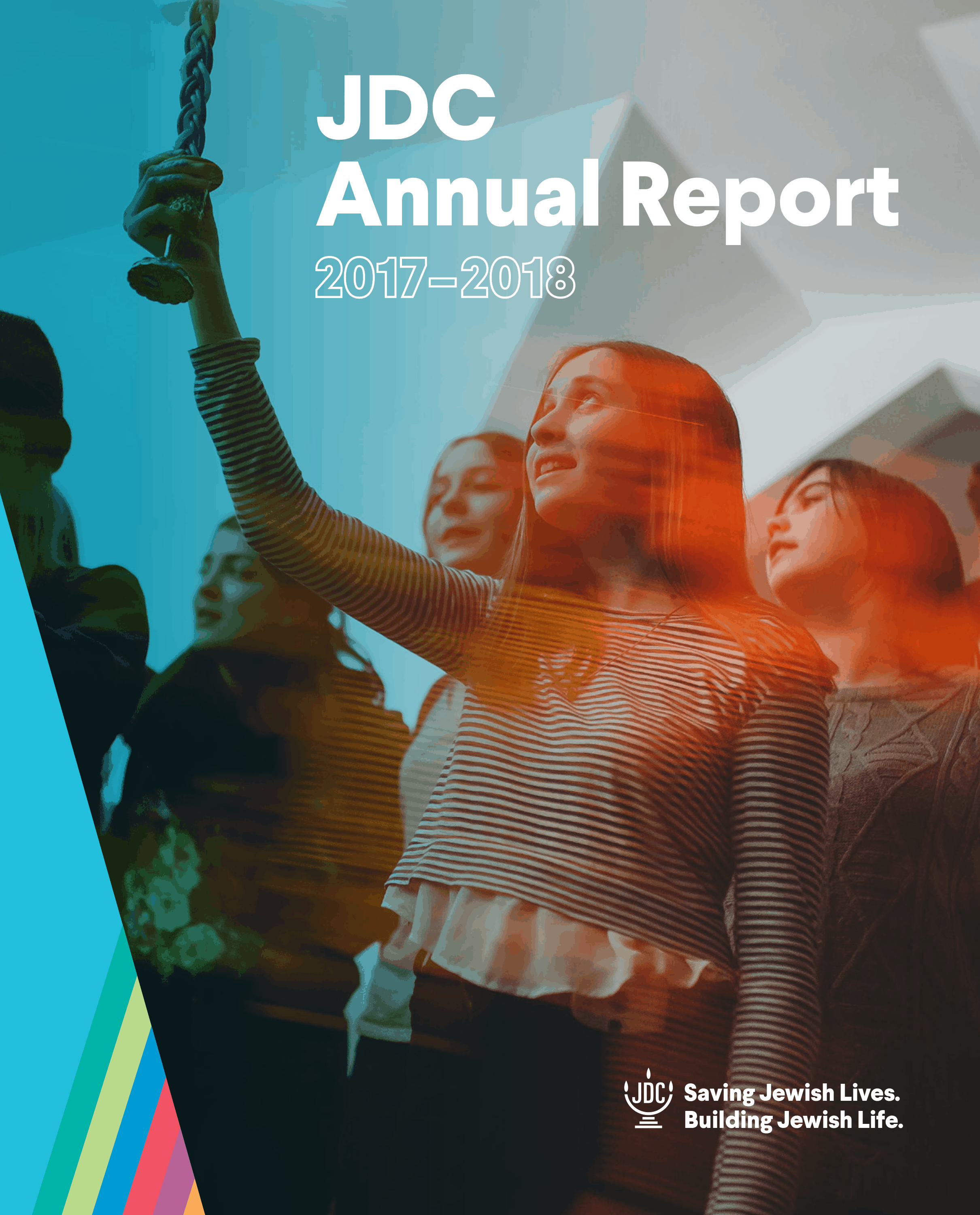 JDC's Annual Report 2018 in which young Jewish girls hold a Havdalah candle above their heads.