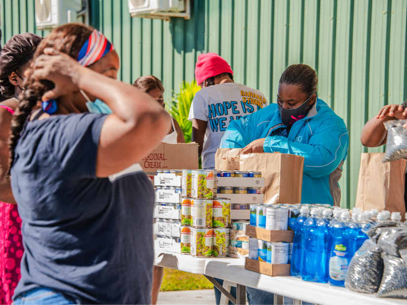 A JDC humanitarian aid workers in the Bahamas dispensing food relief to victims of Hurricane Matthew.
