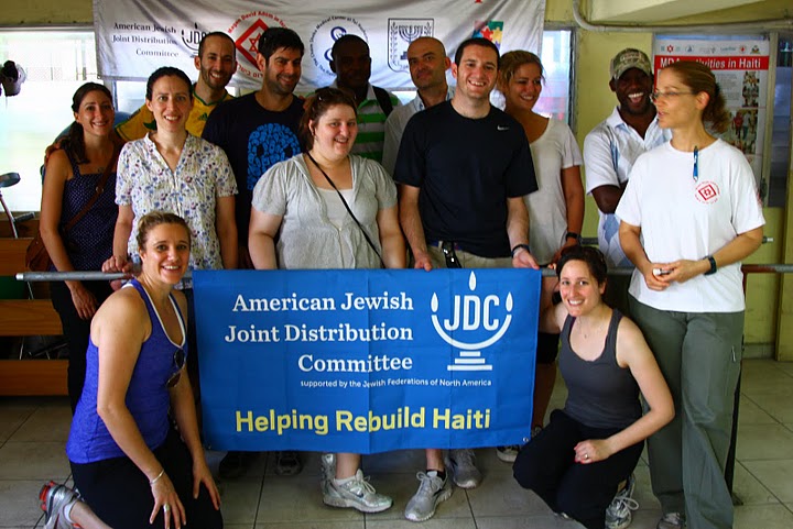 Baptiste (center) pictured with the JDC team that helped his friend, George Exanesius (second from right), recover from injuries sustained in the earthquake.