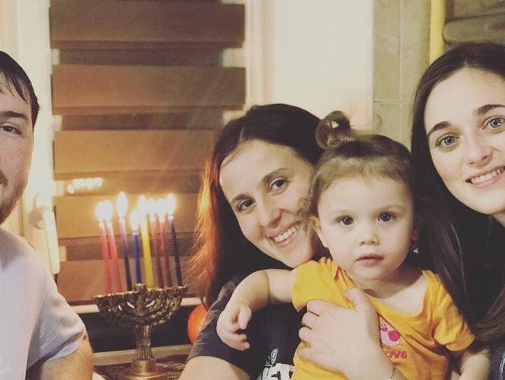 Yulia Zhigailova (center) with her husband and children.
