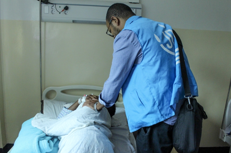 A JDC medical professional assists a spine patient in Addis Ababa, Ethiopia.