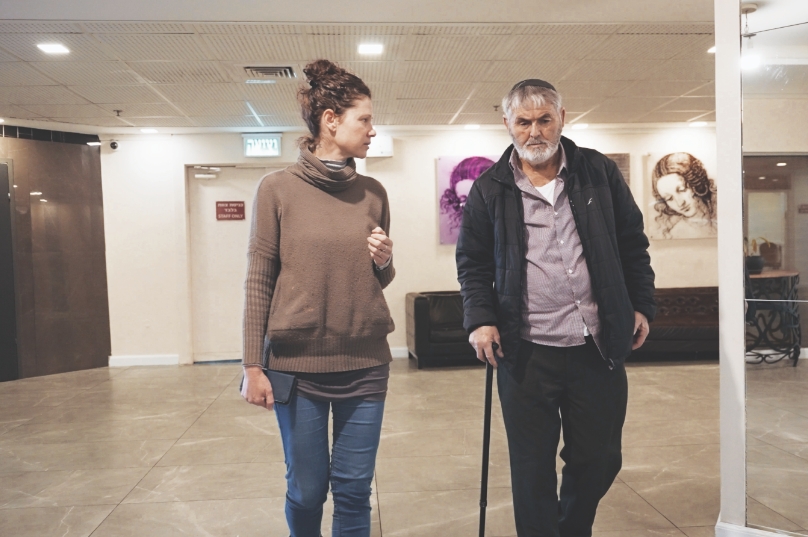 Shlomo Biton, right, meets with his JDC community caseworker.