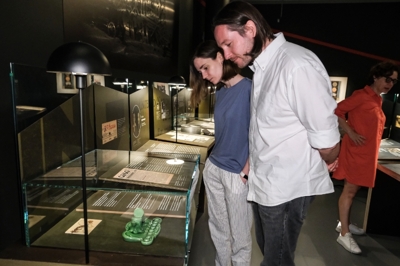 Visitors to the POLIN Museum in Warsaw view a Chanukah menorah on loan from the JDC Archives.