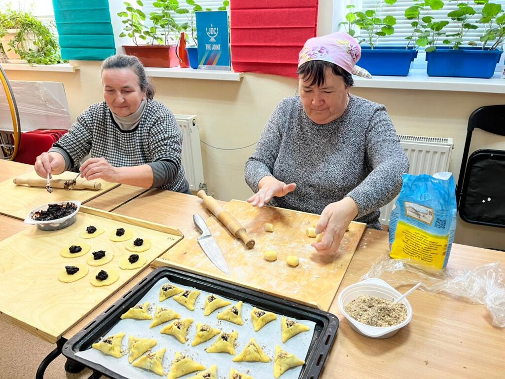 Volunteers prepare hamantaschen for their vulnerable community members at the JDC-supported Hesed Nefesh social service center in Poltava, Ukraine. 